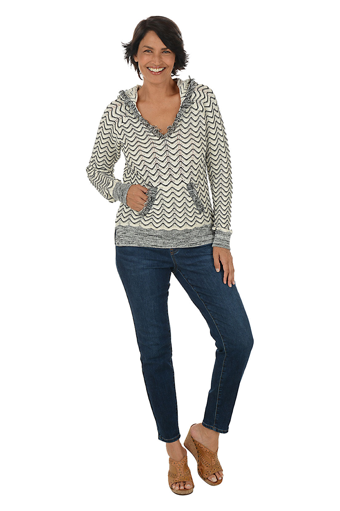 Person wearing dark blue jeans on a white background. Full front shot.