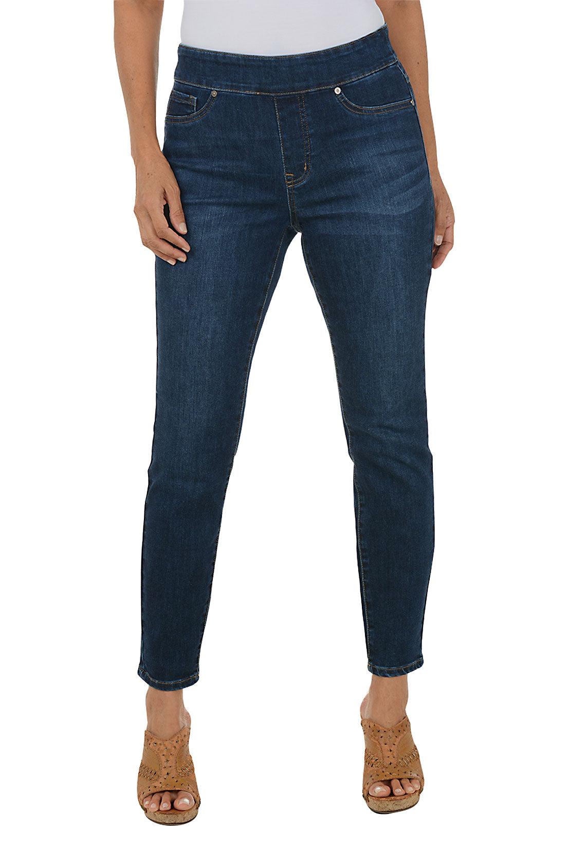 Person wearing dark blue jeans on a white background.