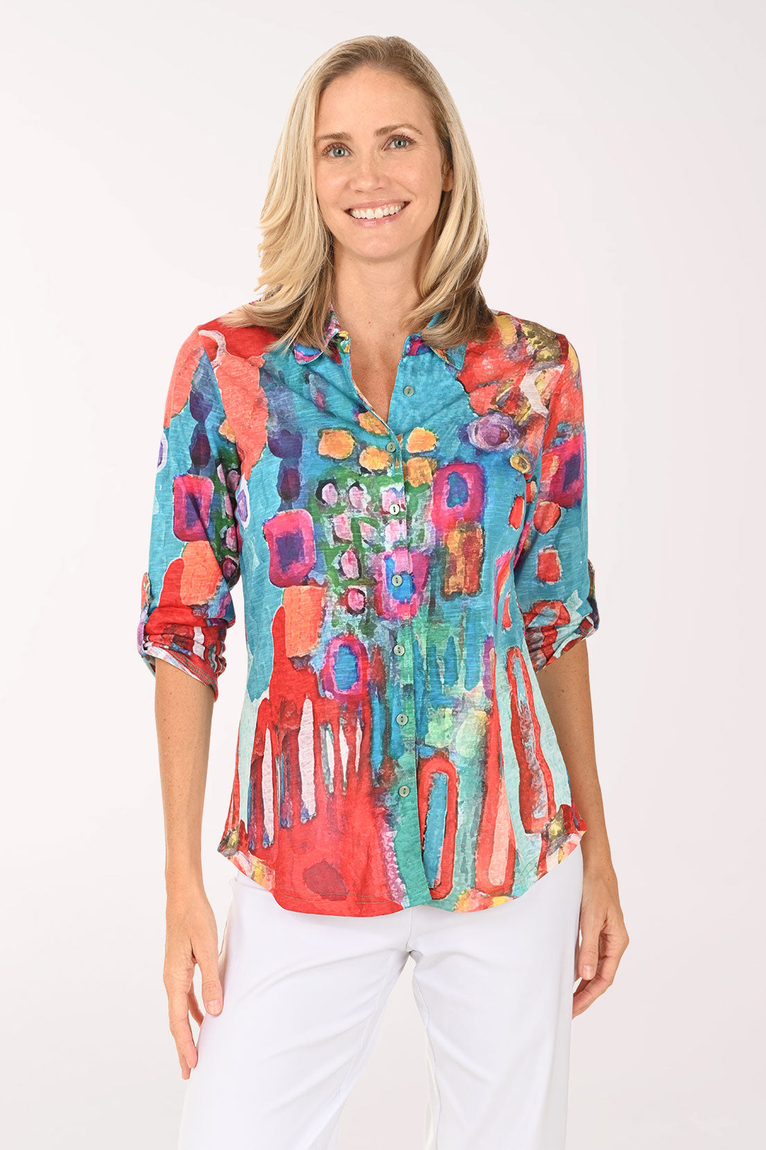 Woman wearing a multi colored button down top