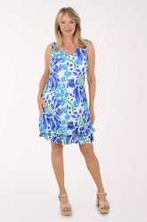Woman wearing a blue floral dress on a white background