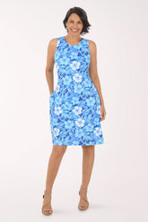 Woman wearing a blue floral dress on a white background