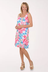 Woman wearing a colorful floral dress on a white background