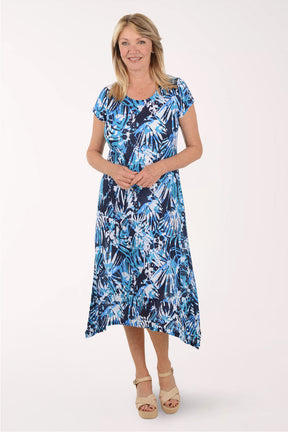 Woman wearing a blue floral dress on a white background