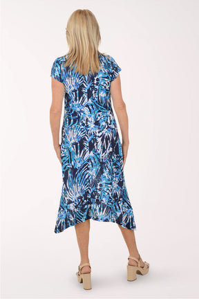 Woman wearing a blue floral dress on a white background