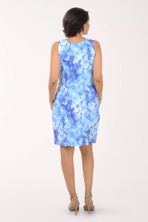 Woman wearing a floral dress on a white background