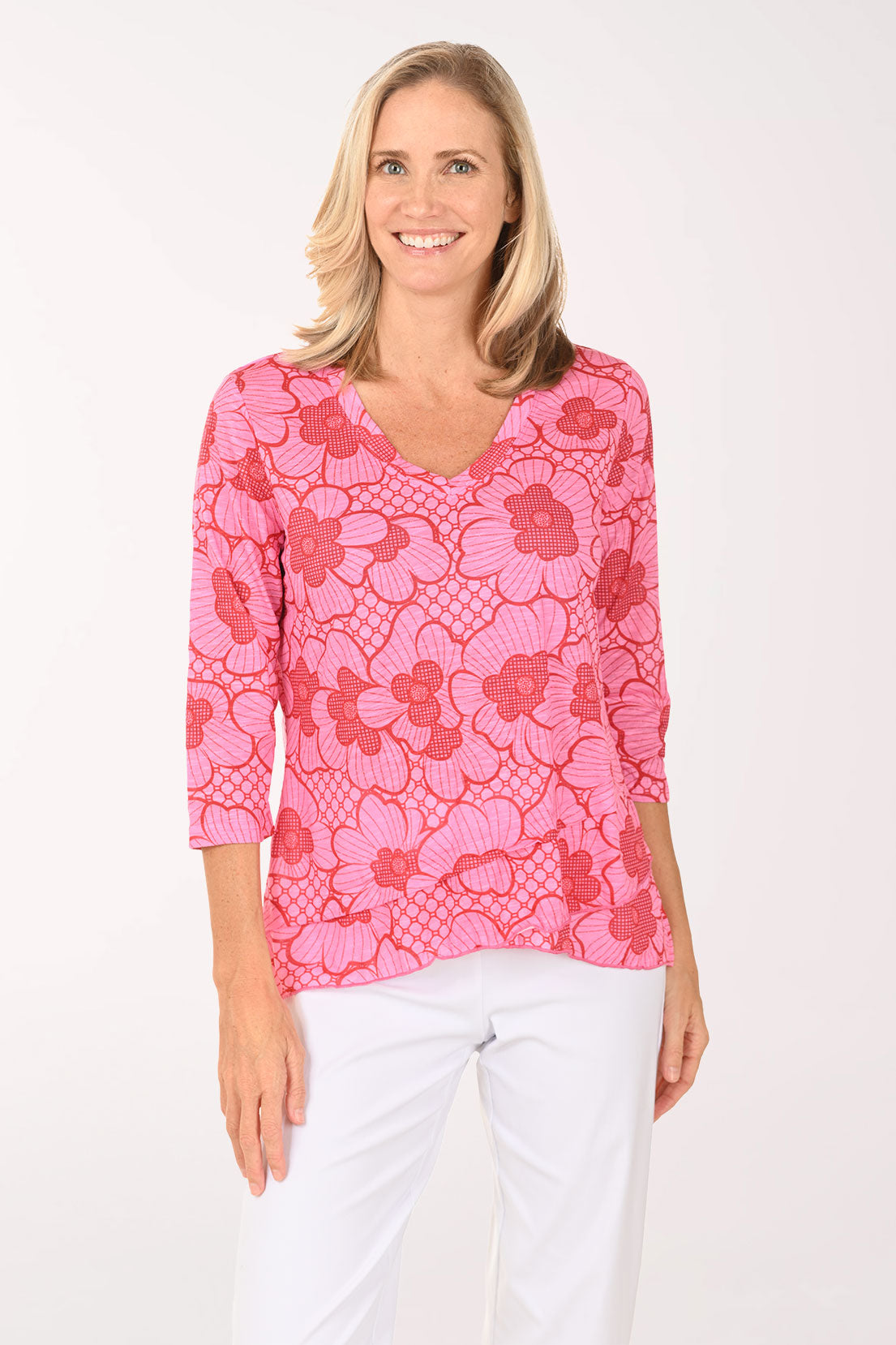 Woman wearing a pink 3/4 sleeve v-neck top