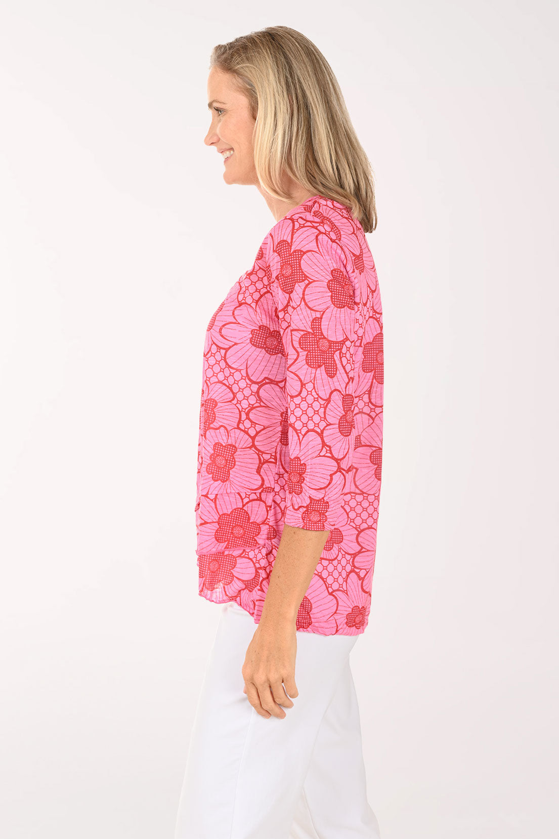Woman wearing a pink 3/4 sleeve v-neck top