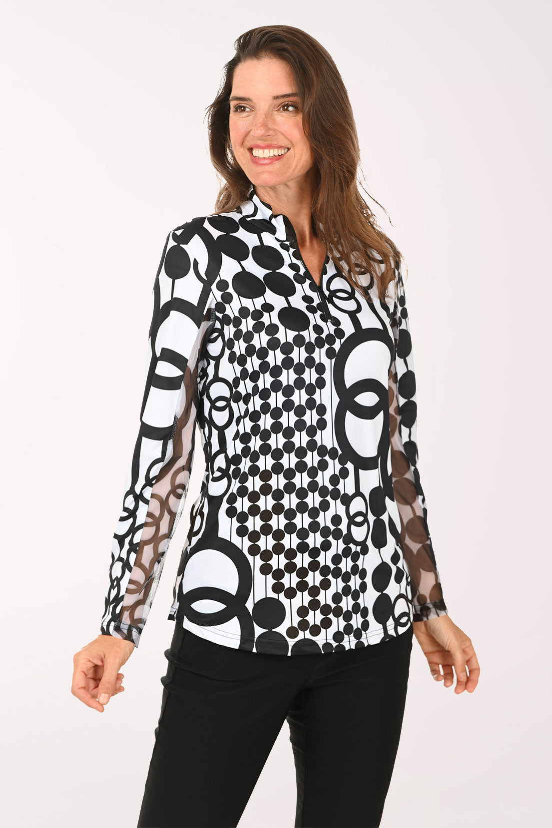 Woman wearing a black and white long sleeve quarter zip-up top