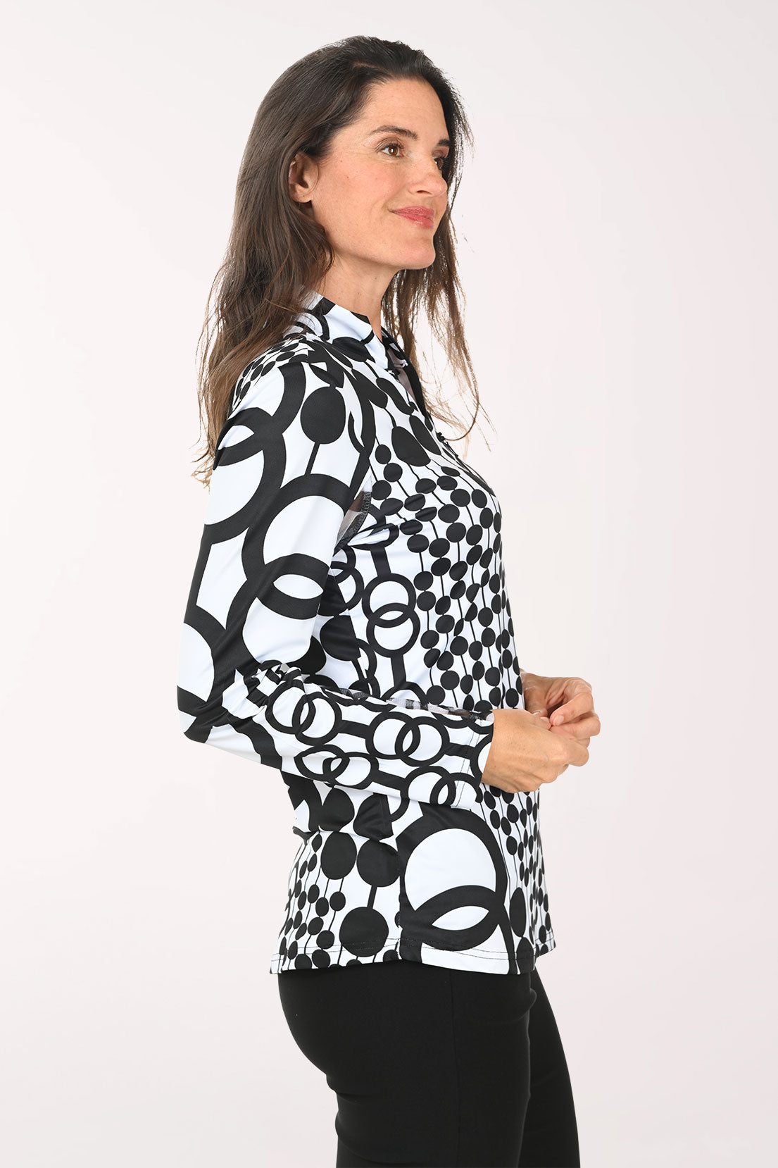 Woman wearing a black and white long sleeve quarter zip-up top