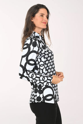 Woman wearing a black and white long sleeve quarter zip-up top