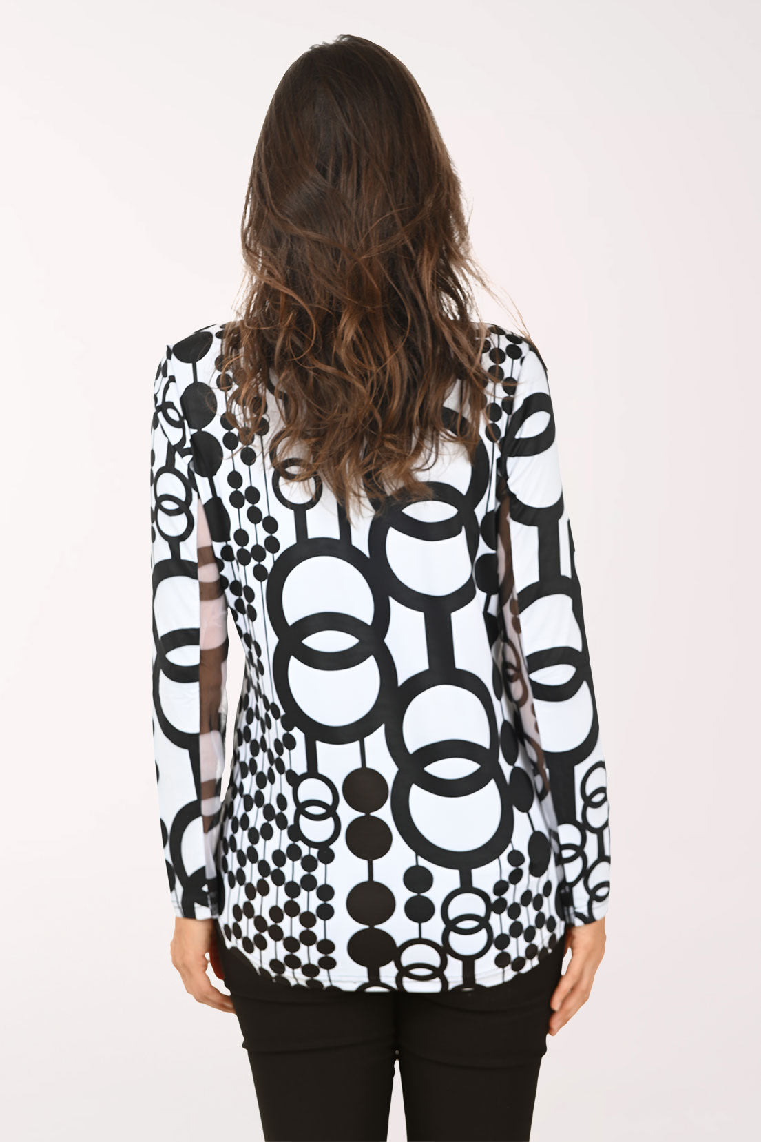 Woman wearing a black and white long sleeve quarter zip-up top