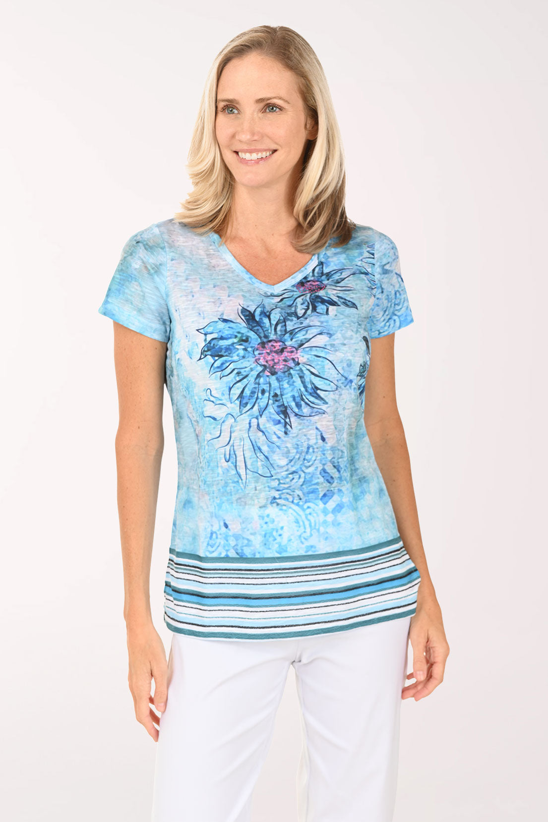 Woman wearing a blue short sleeve top with a daisy on it