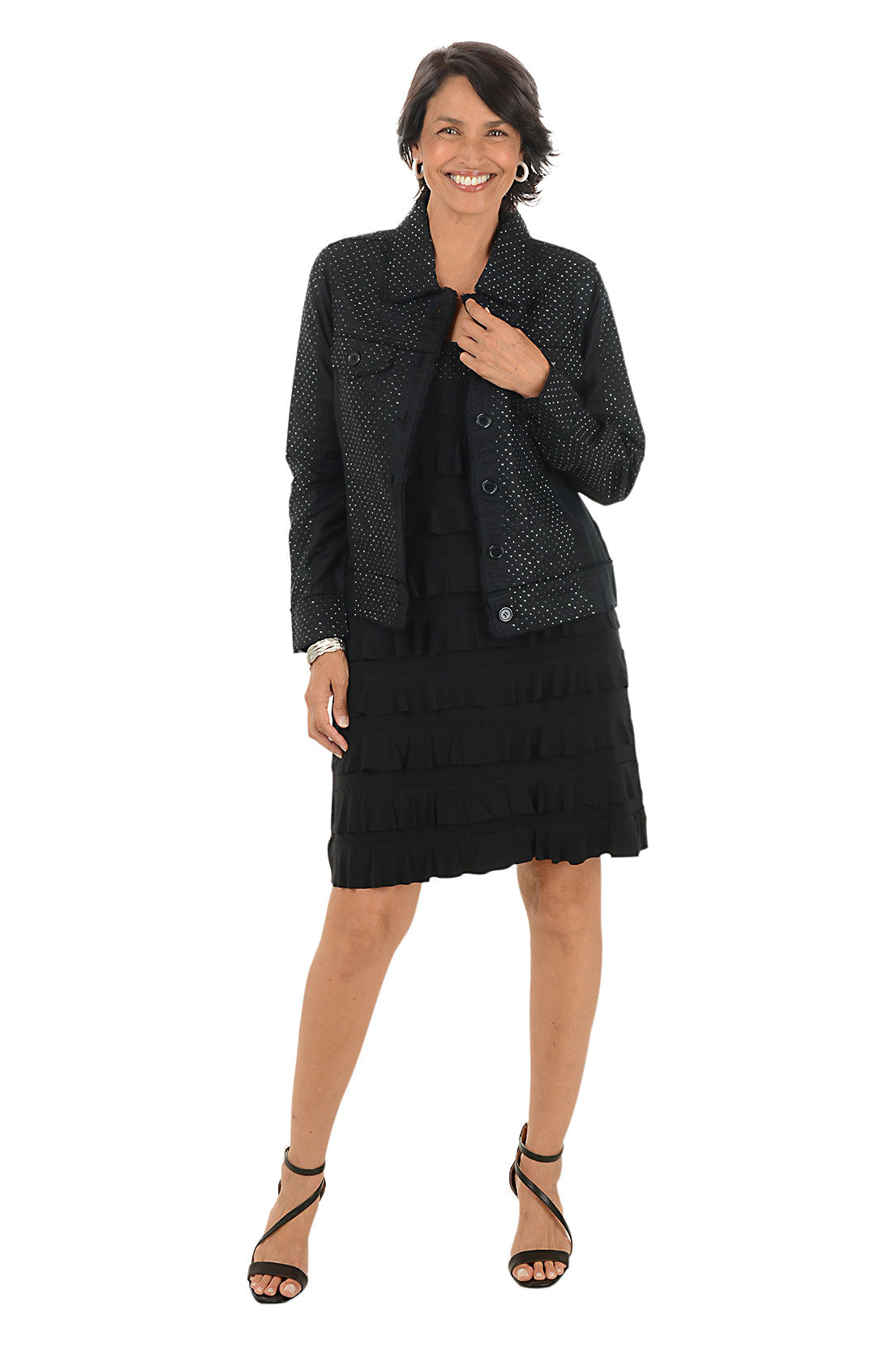 Woman wearing a black patterned jacket and skirt set on a white background