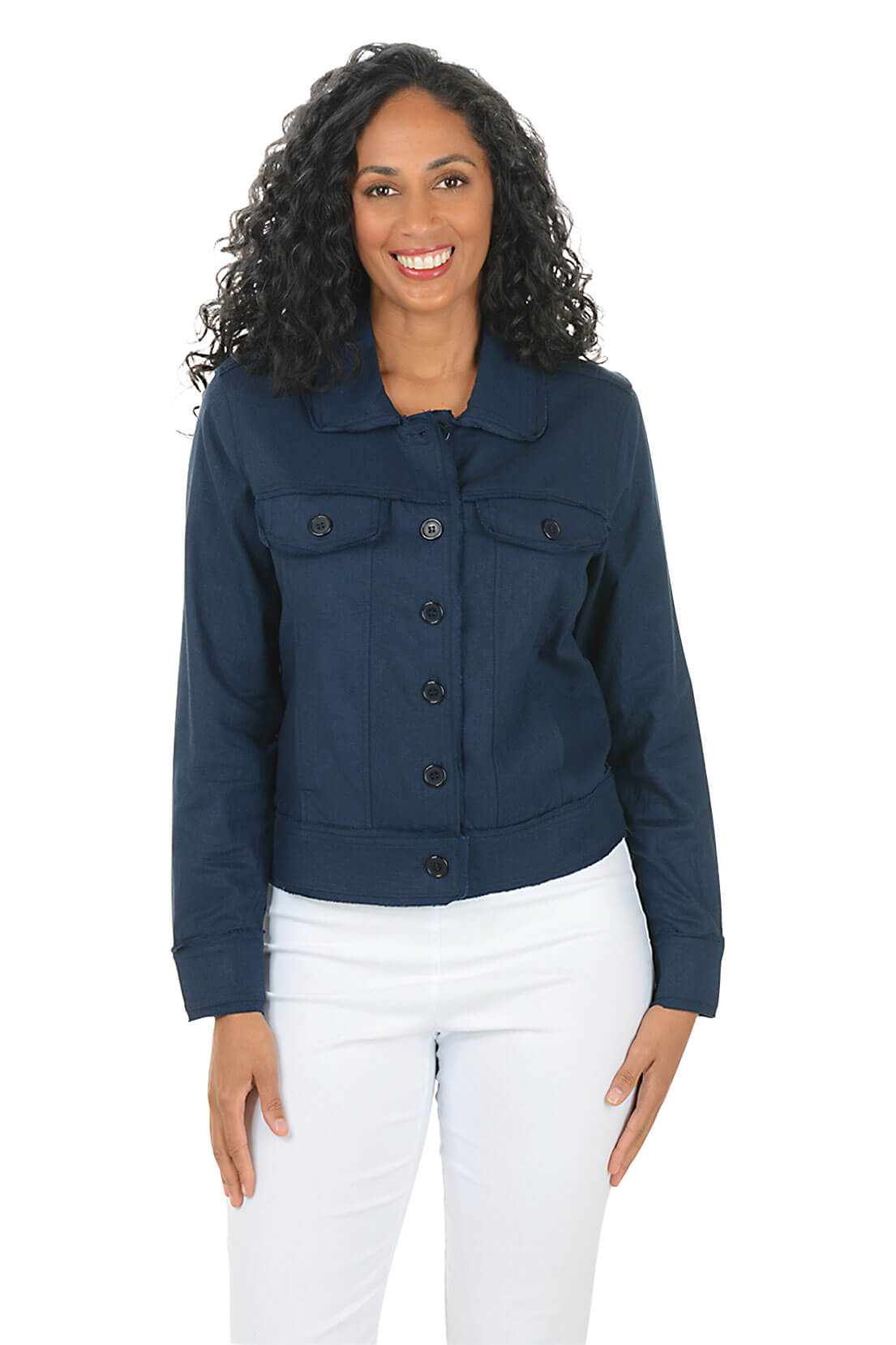 Woman wearing a navy blue jacket and white pants on a white background