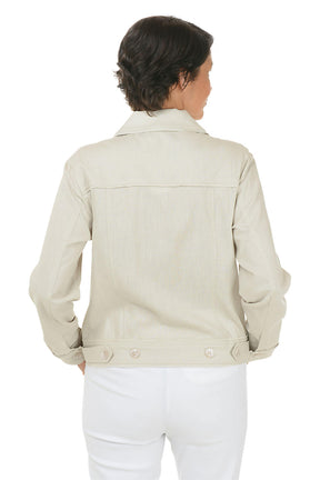 Woman wearing a light-colored jacket and white pants on a white background. Back shot.