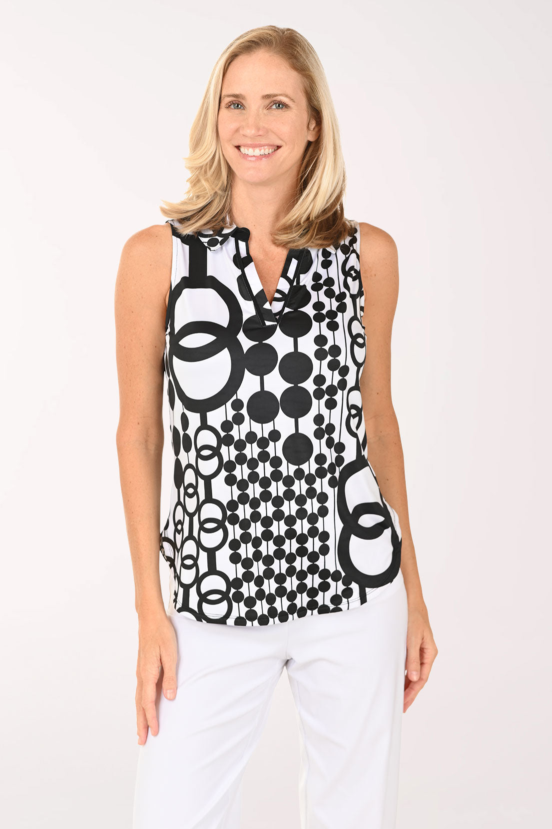 Woman wearing a black and white abstract sleeveless top