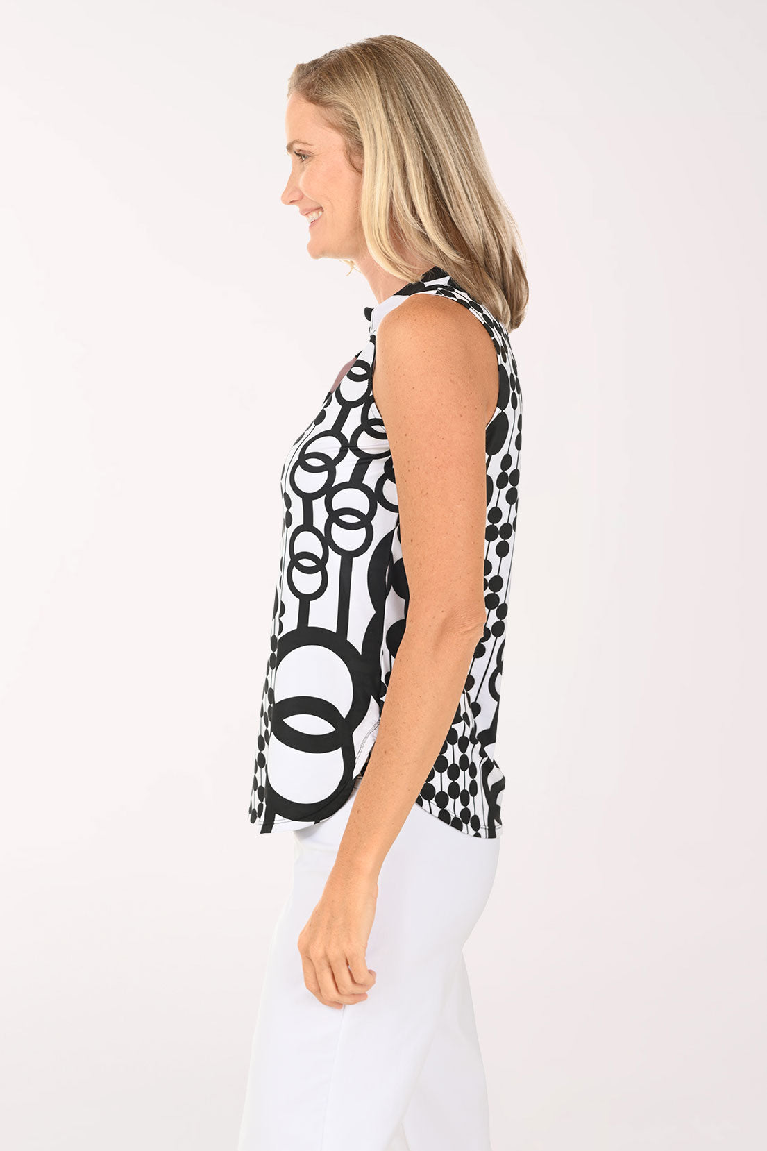 Woman wearing a black and white abstract sleeveless top