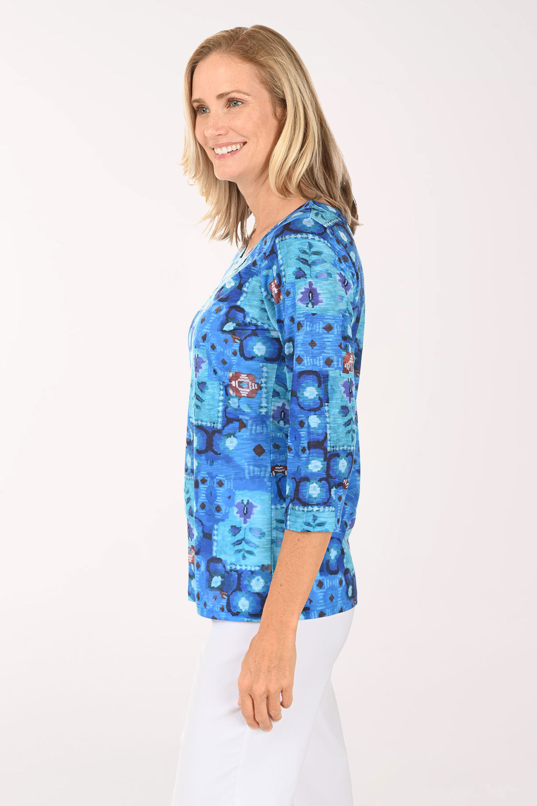 Woman wearing a 3/4 sleeve blue top