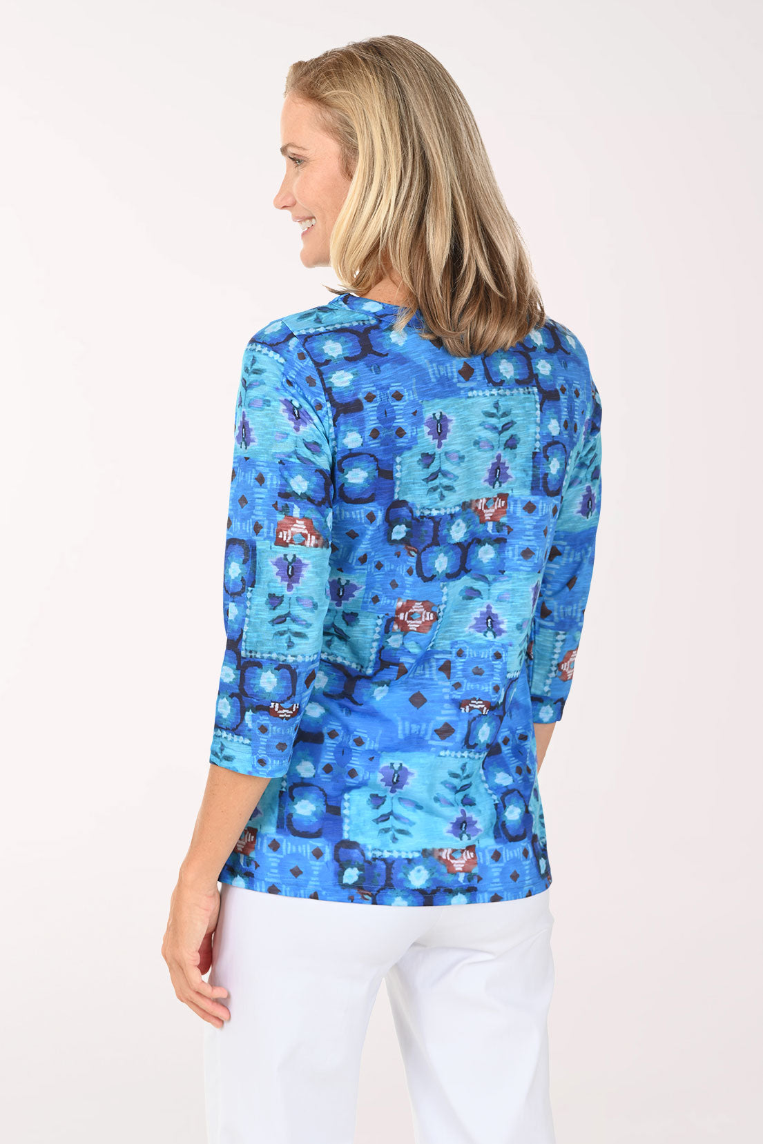 Woman wearing a 3/4 sleeve blue top