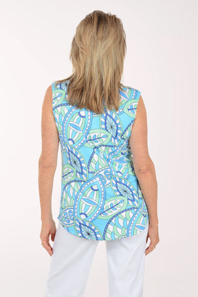 Woman wearing a blue patterned sleeveless top on a white background