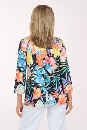 Woman wearing a colorful floral blouse on a white background