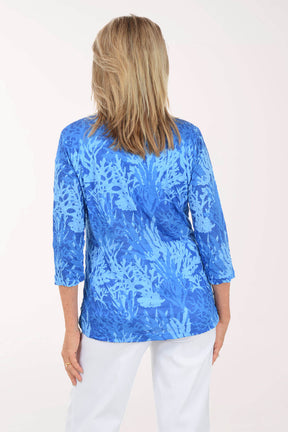 Back shot of model in a blue top. 