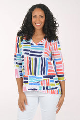 Woman wearing a colorful striped shirt on a white background