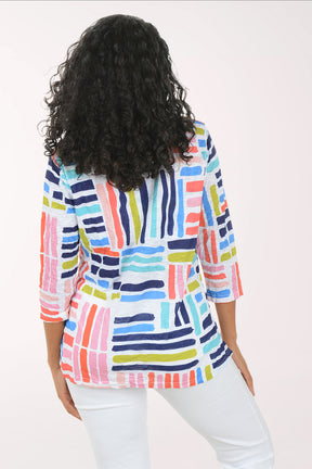 Woman wearing a colorful striped shirt on a white background