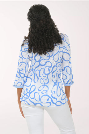 Woman wearing a blue patterned blouse on a white background