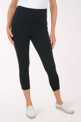A woman wearing black leggings.
