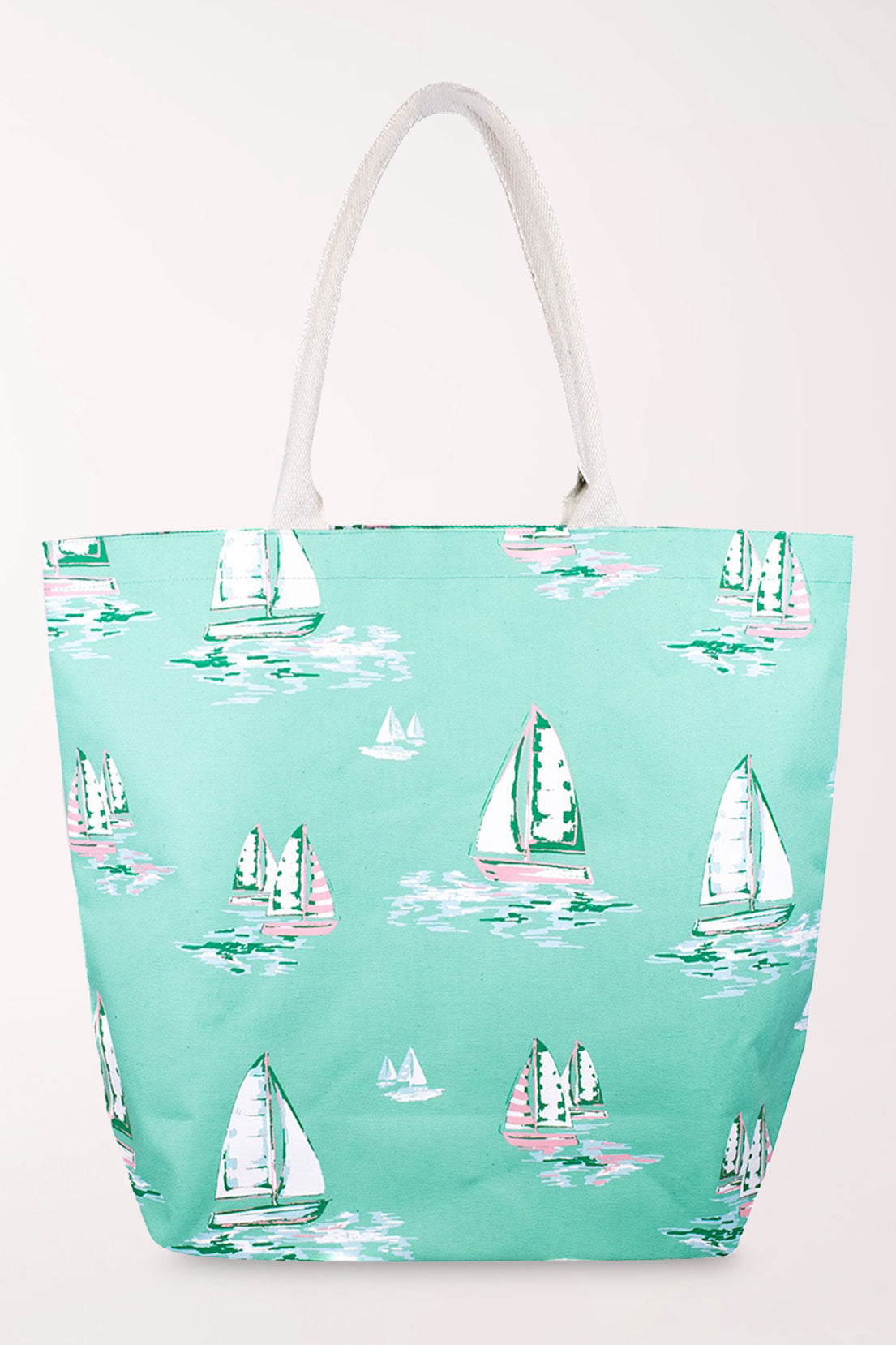 Seafoam green cotton tote bag printed with white and green sailboats on the water, with cream rope handles.