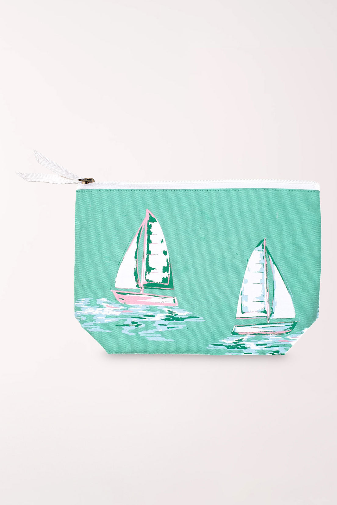 Seafoam green zip-top cosmetics pouch printed with large white and green sailboats, with a white zipper pull.