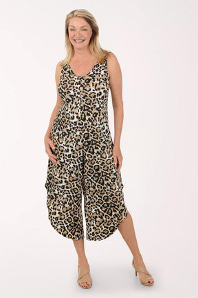 Woman wearing a leopard print jumpsuit on a white background