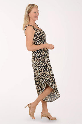 Woman wearing a leopard print jumpsuit on a white background