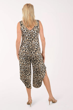 Woman wearing a leopard print jumpsuit on a white background