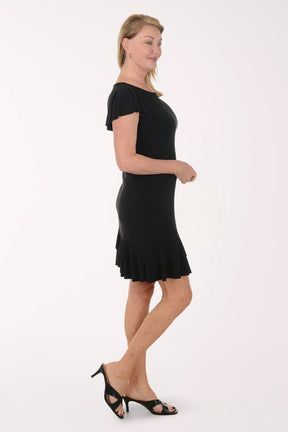 Woman wearing a black dress on a white background
