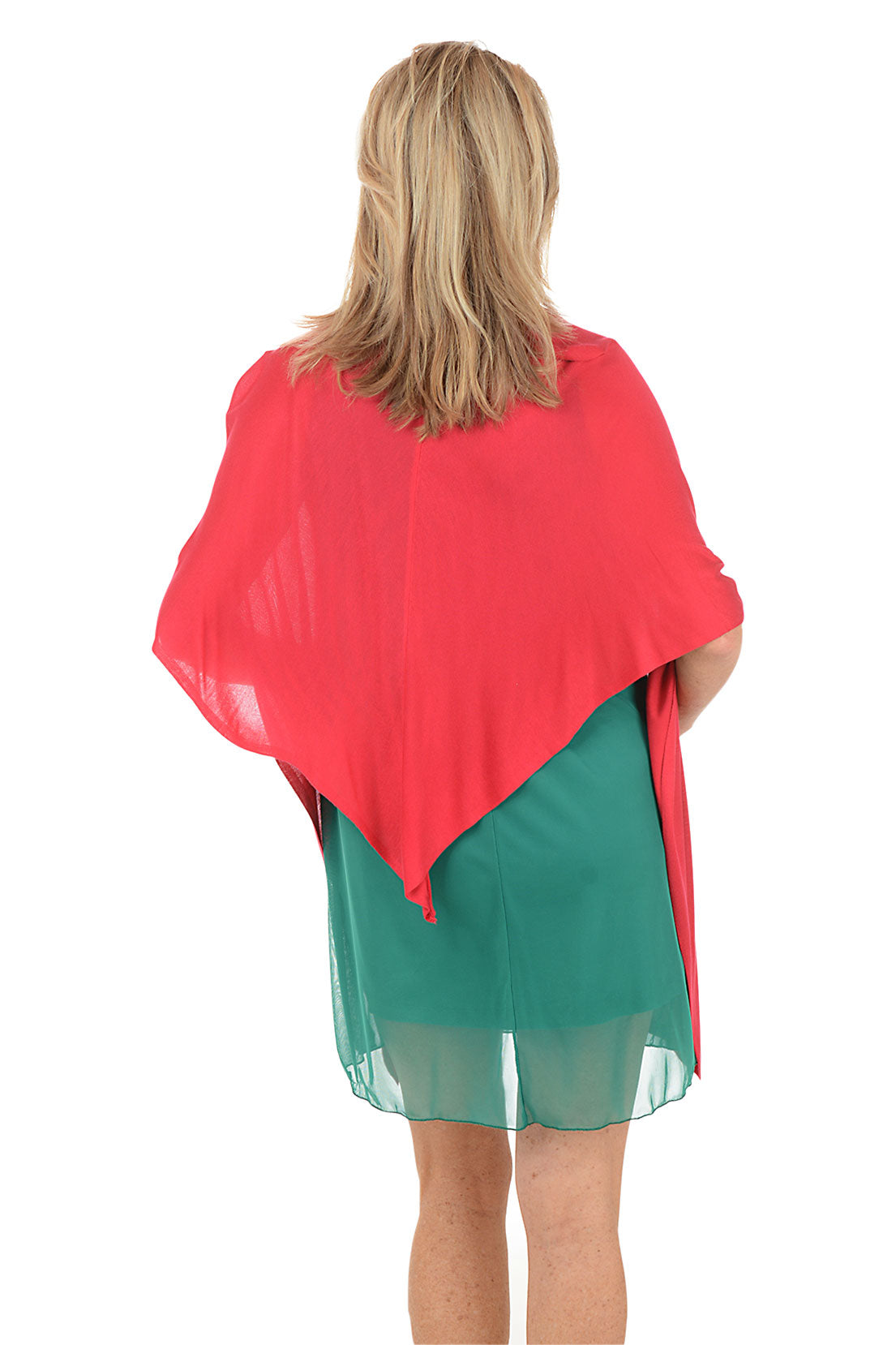 Woman wearing a green dress with a red cardigan on a white background. Back shot.