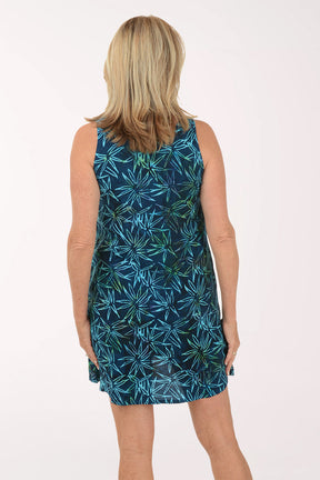 Woman wearing a blue floral dress on a white background