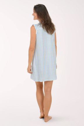 Woman wearing a light blue and white striped dress on a white background