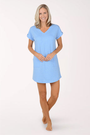 Woman wearing a light blue cover-up on a white background