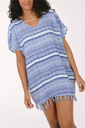 Woman wearing a blue and white striped cover-up on a white background