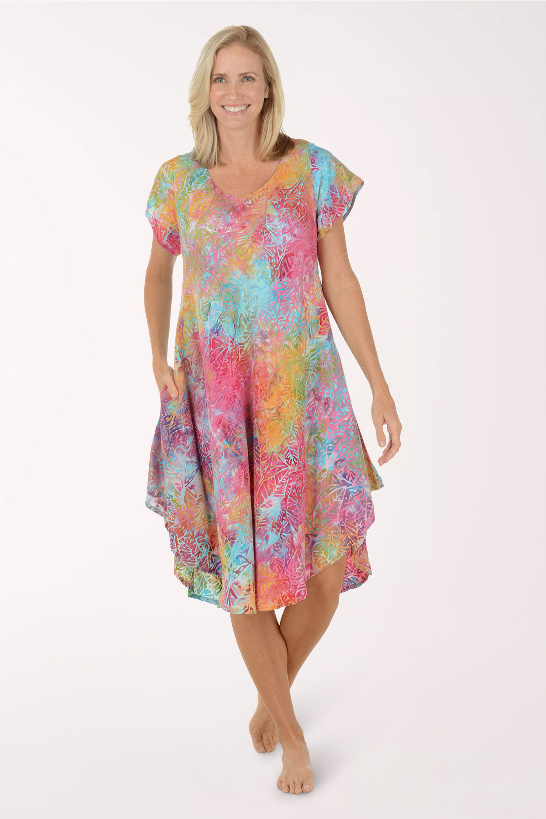 Woman wearing a colorful dress on a white background