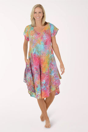 Woman wearing a colorful dress on a white background