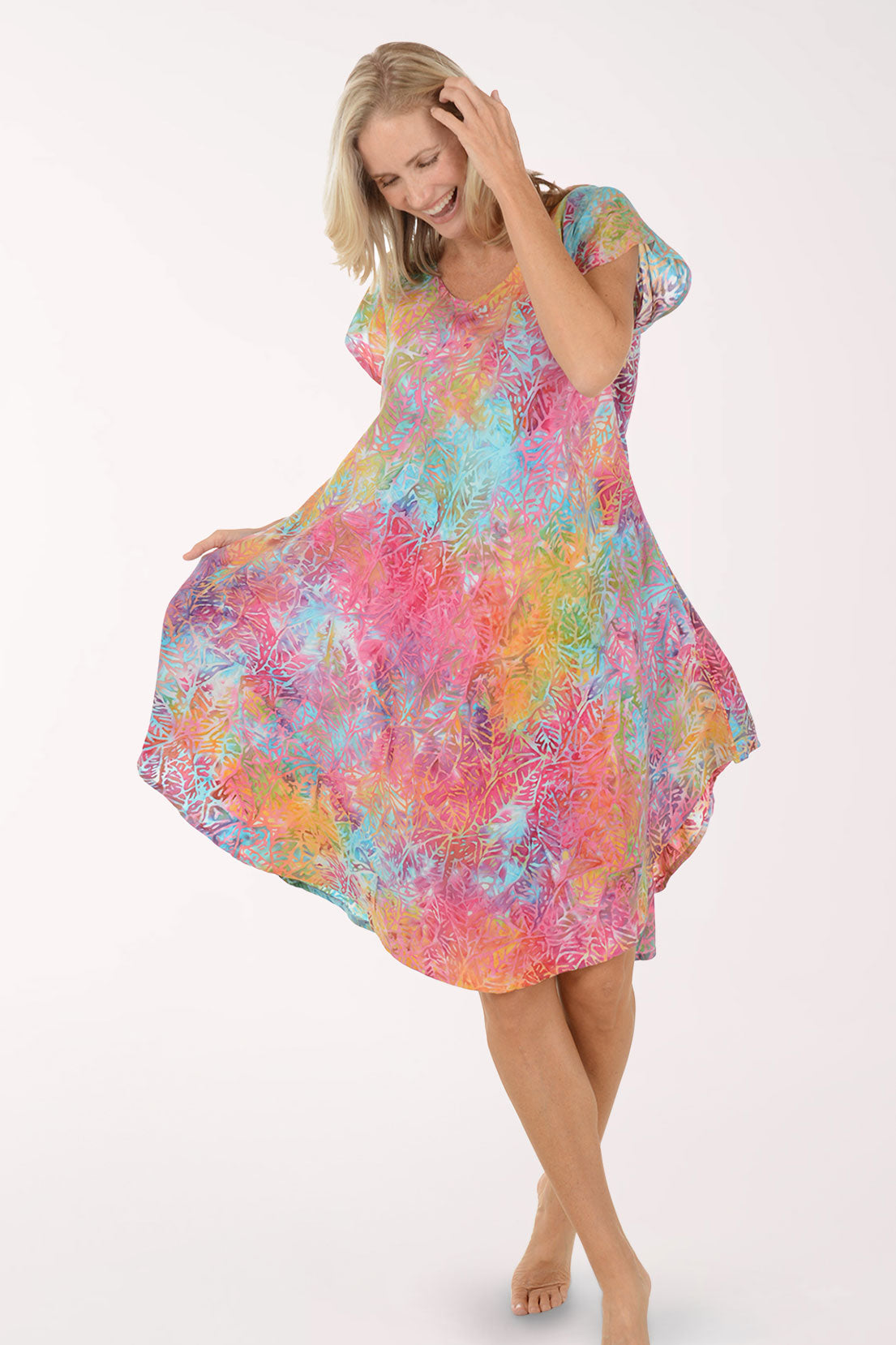 Woman wearing a colorful dress on a white background
