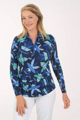 Woman wearing a blue floral patterned shirt on a white background