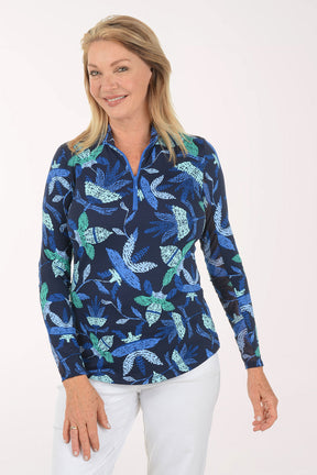 Woman wearing a blue floral patterned shirt on a white background