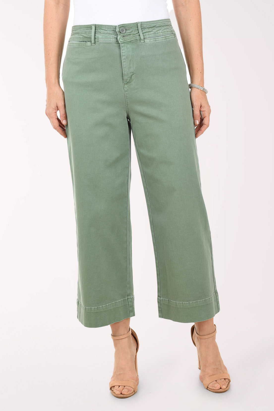 Person wearing green pants on a white background