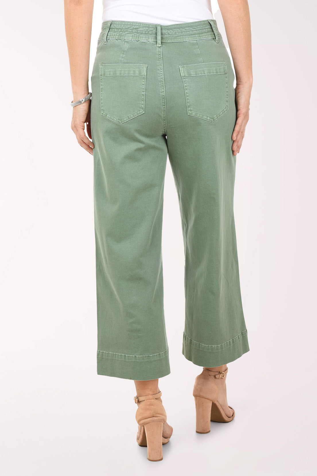 Person wearing green pants on a white background