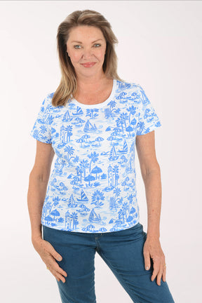 Woman wearing a blue and white patterned shirt on a white background