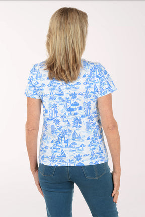 Woman wearing a blue and white patterned shirt on a white background